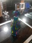 small swirly 6 sided bottle with glass stopper