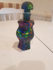 small swirly 6 sided bottle with glass stopper