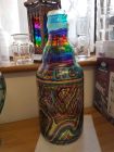 large coin bottle chunky glass with chakra stripes and whirls