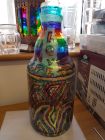 large coin bottle chunky glass with chakra stripes and whirls