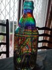 large coin bottle chunky glass with chakra stripes and whirls