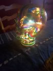 funky glass skull painted in chakra colours with hearts and positive affirmations with led fairy lights inside