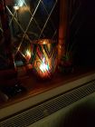 vase with blues and red with candle shadows